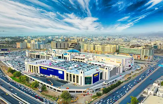 Aerial view of Oman Avenues Mall in Al-Ghubra, Muscat, surrounded by cityscape and major roads